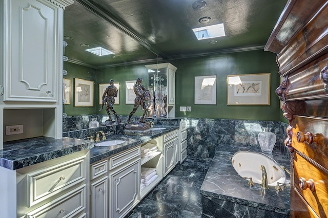 200 Westmoreland St, Houston, TX 77006 - full bath featuring double vanity, marble finish floors, crown molding, a jetted tub, and a skylight