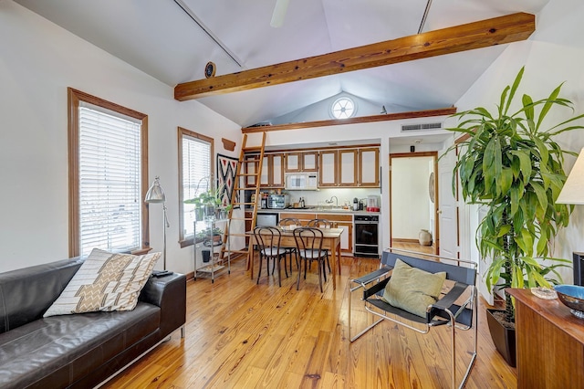200 Westmoreland St, Houston, TX 77006 - living area featuring light wood-type flooring and bar area