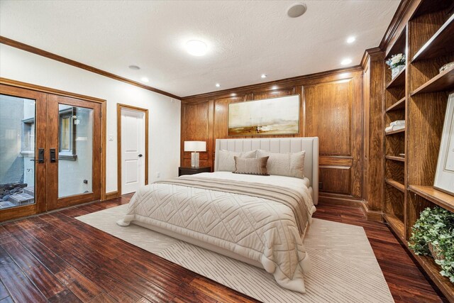 3224 Alabama Ct, Houston, TX 77027 - bedroom with dark wood-style flooring, ornamental molding, wood walls, french doors, and a textured ceiling