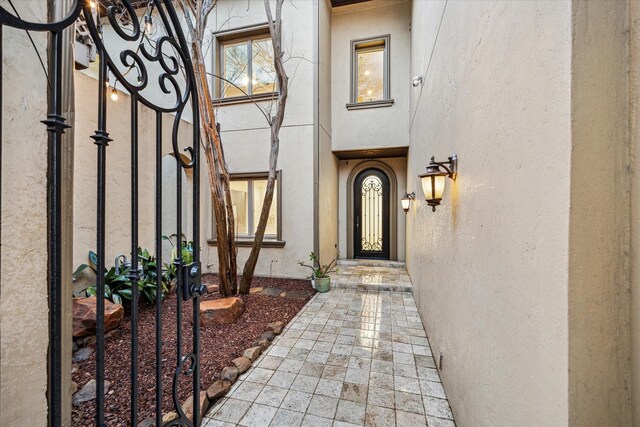 3224 Alabama Ct, Houston, TX 77027 - entrance to property featuring stucco siding and a gate