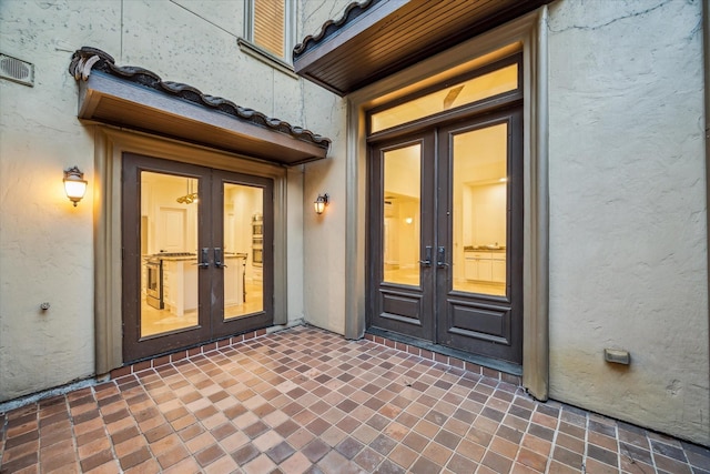 3224 Alabama Ct, Houston, TX 77027 - property entrance with french doors and stucco siding