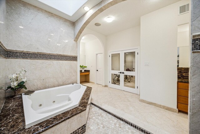 3224 Alabama Ct, Houston, TX 77027 - full bath with a whirlpool tub and baseboards