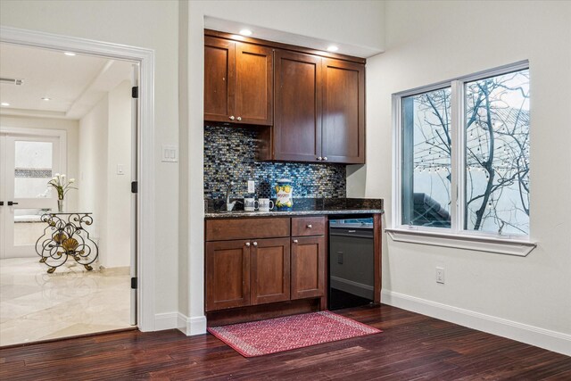 3224 Alabama Ct, Houston, TX 77027 - bar area featuring black dishwasher, dark wood-style flooring, decorative backsplash, baseboards, and recessed lighting