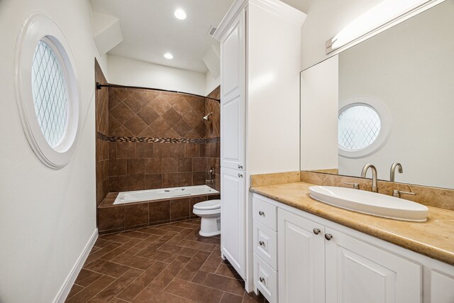 3224 Alabama Ct, Houston, TX 77027 - bathroom featuring vanity, tiled shower / bath, toilet, and recessed lighting