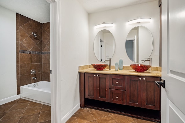 3224 Alabama Ct, Houston, TX 77027 - full bath with double vanity, shower / bathtub combination, baseboards, and tile patterned flooring