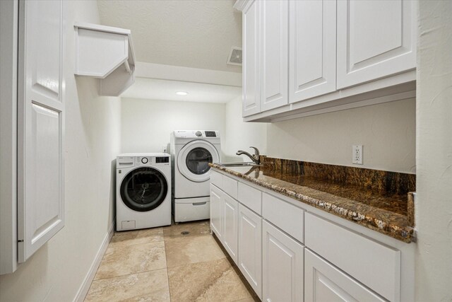 3224 Alabama Ct, Houston, TX 77027 - laundry room featuring washer and dryer, a sink, and baseboards