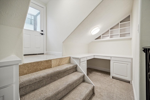 3224 Alabama Ct, Houston, TX 77027 - stairs featuring built in desk, carpet flooring, and baseboards