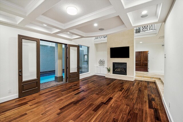 3224 Alabama Ct, Houston, TX 77027 - unfurnished living room with wood finished floors, coffered ceiling, beam ceiling, ornamental molding, and baseboards