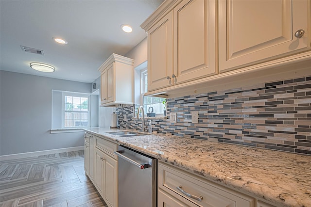 11211 Sageriver Dr, Houston, TX 77089 - kitchen with dishwasher, a sink, baseboards, tasteful backsplash, and recessed lighting
