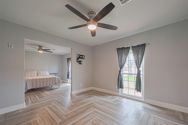 11211 Sageriver Dr, Houston, TX 77089 - unfurnished bedroom featuring baseboards and ceiling fan