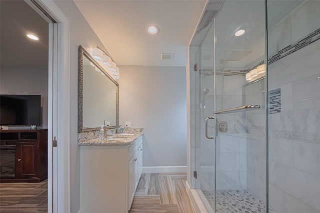 11211 Sageriver Dr, Houston, TX 77089 - bathroom featuring vanity, a stall shower, baseboards, and recessed lighting