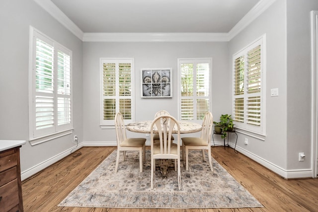 2223 Hilshire Trail Dr, Houston, TX 77080 - dining room featuring crown molding, wood finished floors, and baseboards