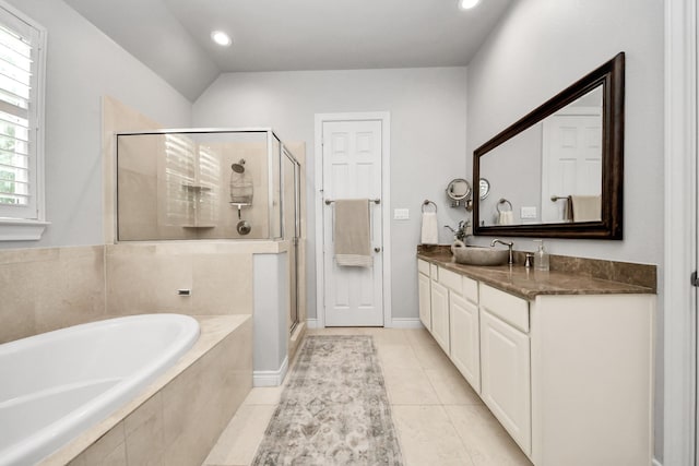 2223 Hilshire Trail Dr, Houston, TX 77080 - bathroom featuring a bath, a shower stall, double vanity, tile patterned flooring, and recessed lighting