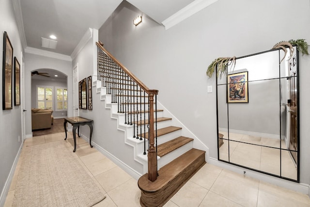 2223 Hilshire Trail Dr, Houston, TX 77080 - stairs featuring crown molding, arched walkways, tile patterned flooring, recessed lighting, and baseboards