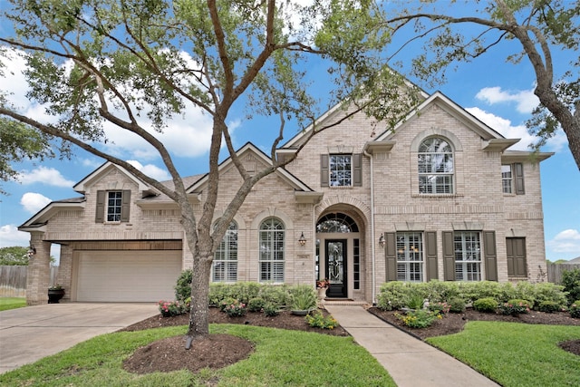 25606 Payton Chase Ct, Katy, TX 77494 - french provincial home featuring brick siding, driveway, a front lawn, and an attached garage