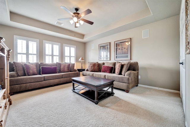 25606 Payton Chase Ct, Katy, TX 77494 - carpeted living area with a raised ceiling, a ceiling fan, and baseboards