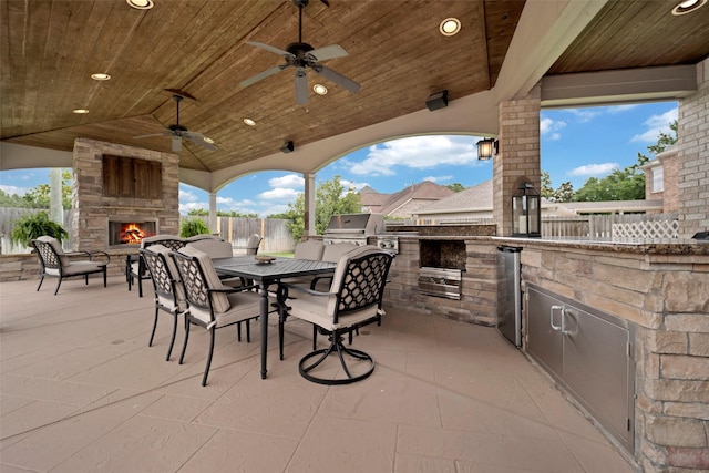 25606 Payton Chase Ct, Katy, TX 77494 - view of patio with an outdoor stone fireplace, outdoor dining space, and a ceiling fan