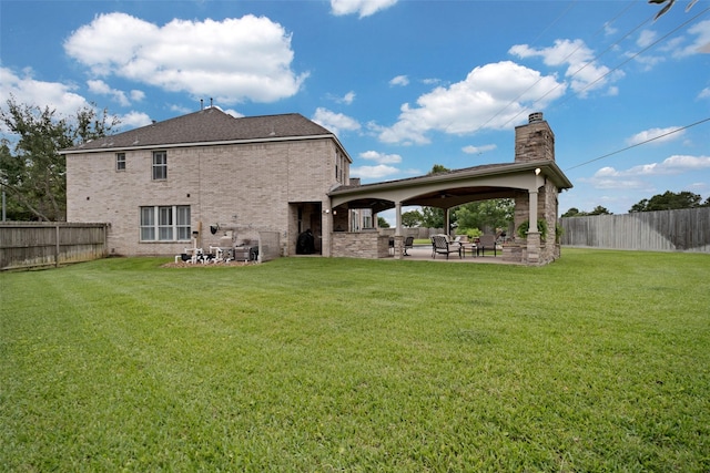25606 Payton Chase Ct, Katy, TX 77494 - rear view of house featuring a chimney, a patio, and brick siding
