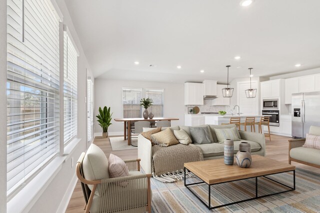 2010 Bluff Oak Ct, Conroe, TX 77304 - living room featuring recessed lighting, baseboards, and light wood-style flooring