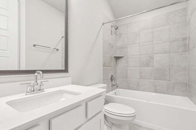 2010 Bluff Oak Ct, Conroe, TX 77304 - bathroom featuring toilet, vanity, and bathtub / shower combination