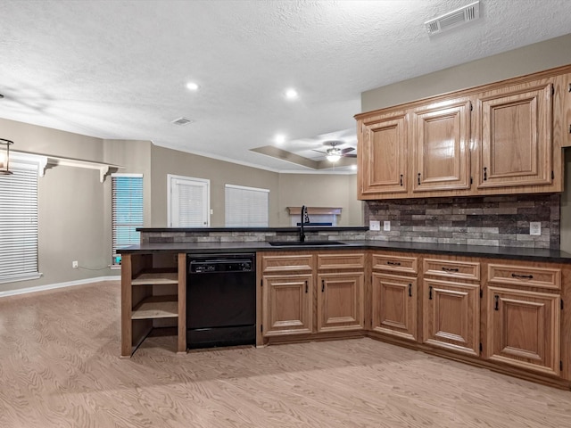 15615 Atwood Ln, Crosby, TX 77532 - kitchen with dishwasher, a sink, light wood finished floors, dark countertops, and recessed lighting