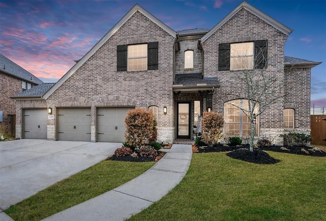 23402 Skylark Falls Trl, Katy, TX 77493 - french provincial home featuring brick siding, a front lawn, concrete driveway, and roof with shingles