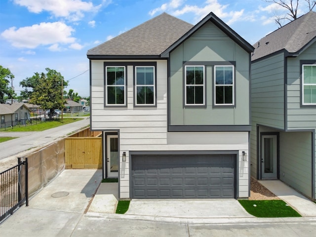 2410 Vaughn St Unit B, Houston, TX 77093 - view of front of property featuring driveway, an attached garage, and roof with shingles