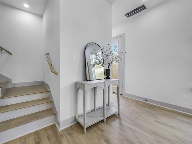 2410 Vaughn St Unit B, Houston, TX 77093 - stairs with wood finished floors, baseboards, and recessed lighting