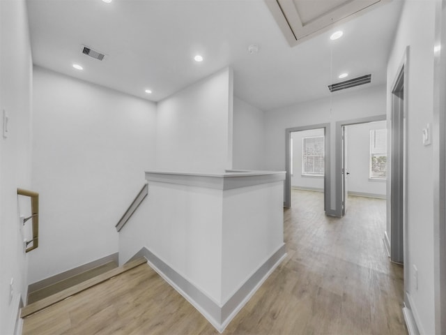 2410 Vaughn St Unit B, Houston, TX 77093 - hall with attic access, an upstairs landing, light wood-style flooring, recessed lighting, and baseboards