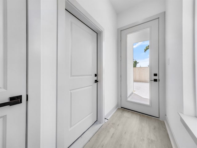 2410 Vaughn St Unit B, Houston, TX 77093 - doorway with light wood-style floors and baseboards