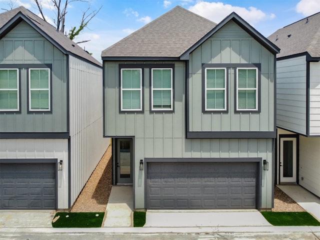 2410 Vaughn St Unit B, Houston, TX 77093 - view of front of home featuring a garage, a shingled roof, and driveway