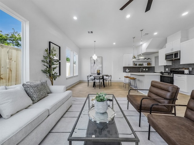 2410 Vaughn St Unit B, Houston, TX 77093 - living room with plenty of natural light, a ceiling fan, recessed lighting, light wood finished floors, and baseboards
