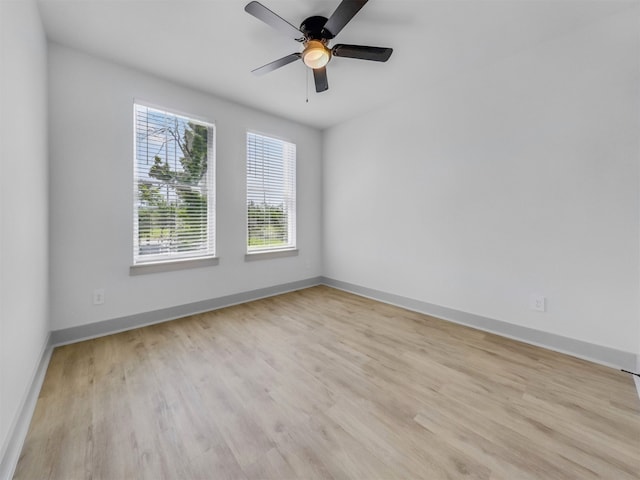 2410 Vaughn St Unit B, Houston, TX 77093 - empty room featuring light wood finished floors, baseboards, and a ceiling fan