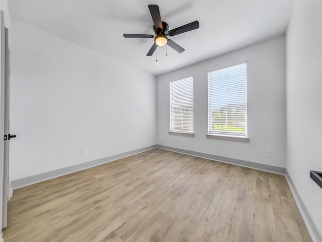 2410 Vaughn St Unit B, Houston, TX 77093 - empty room featuring light wood-style floors, baseboards, and a ceiling fan