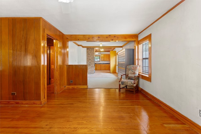 914 S Hill St, Alvin, TX 77511 - interior space featuring light wood-style floors, baseboards, crown molding, and wood walls
