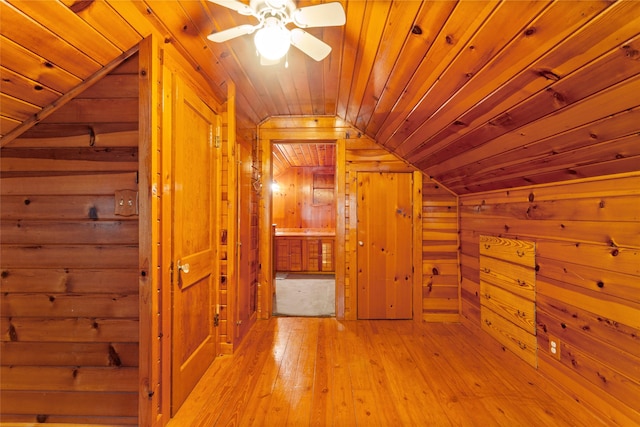 914 S Hill St, Alvin, TX 77511 - hallway with lofted ceiling, wood walls, light wood finished floors, and wood ceiling