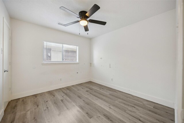 4615 Pleasant Trl, Fresno, TX 77545 - spare room with light wood-style floors, baseboards, and ceiling fan