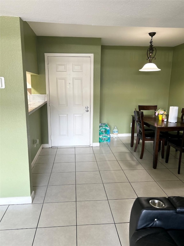 206 Plaza Verde Dr Unit D16, Houston, TX 77038 - dining space featuring light tile patterned floors and baseboards