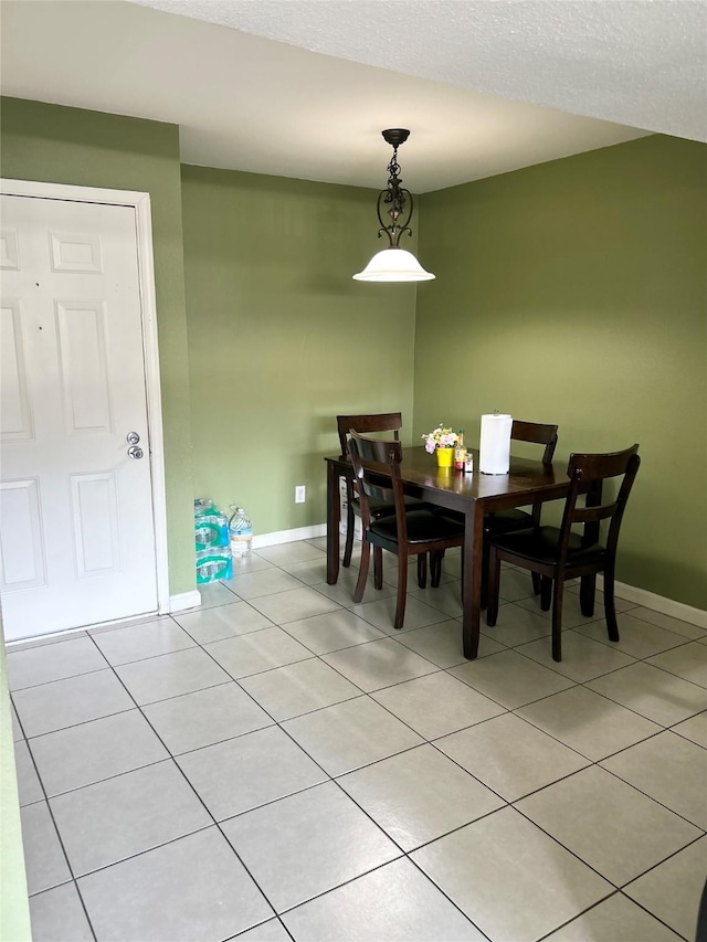 206 Plaza Verde Dr Unit D16, Houston, TX 77038 - dining space featuring light tile patterned floors and baseboards