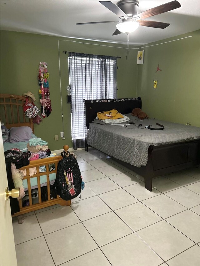 206 Plaza Verde Dr Unit D16, Houston, TX 77038 - bedroom with light tile patterned floors and ceiling fan