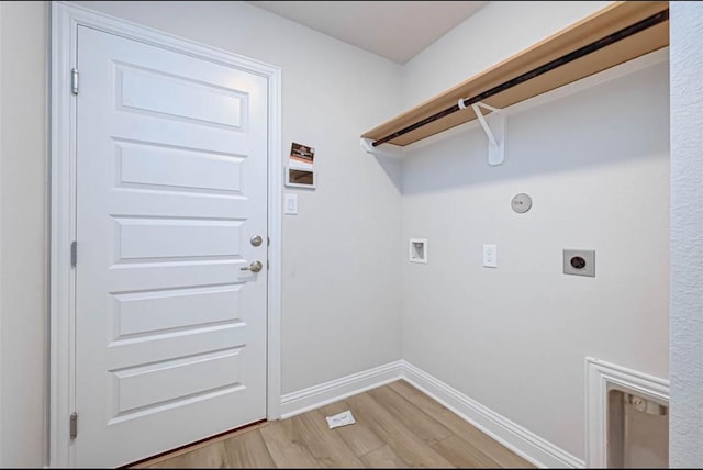 2301 Sereno Shores Dr, Texas City, TX 77568 - washroom with electric dryer hookup, light wood-style flooring, washer hookup, and baseboards