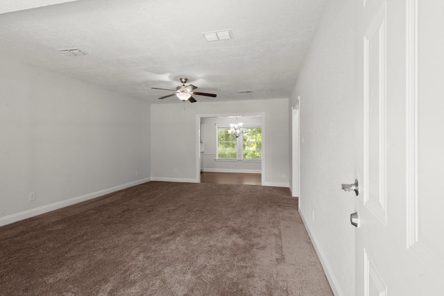 14790 N Tram Rd, Splendora, TX 77372 - carpeted empty room with baseboards, ceiling fan, a chandelier, and a textured ceiling