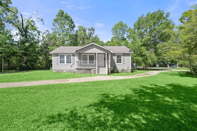 14790 N Tram Rd, Splendora, TX 77372 - view of front of home featuring a front yard and a porch