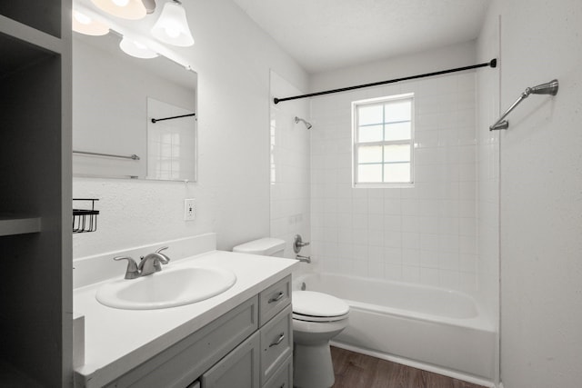 14790 N Tram Rd, Splendora, TX 77372 - full bath featuring vanity, wood finished floors, toilet, and shower / tub combination