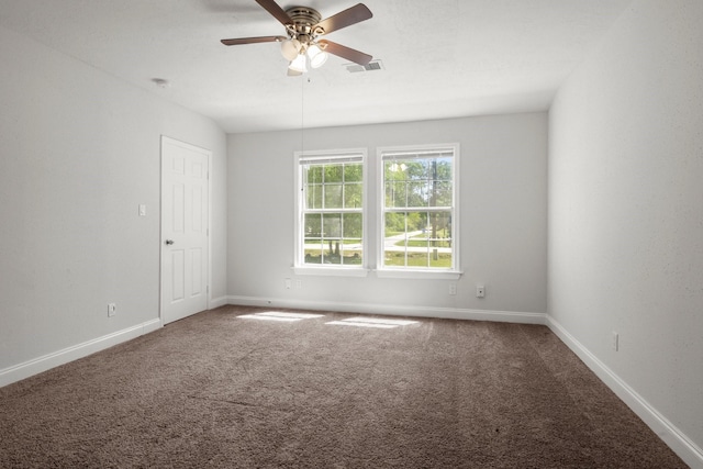 14790 N Tram Rd, Splendora, TX 77372 - unfurnished room with ceiling fan, carpet floors, and baseboards