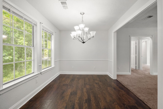 14790 N Tram Rd, Splendora, TX 77372 - empty room featuring a chandelier, baseboards, and dark wood-type flooring