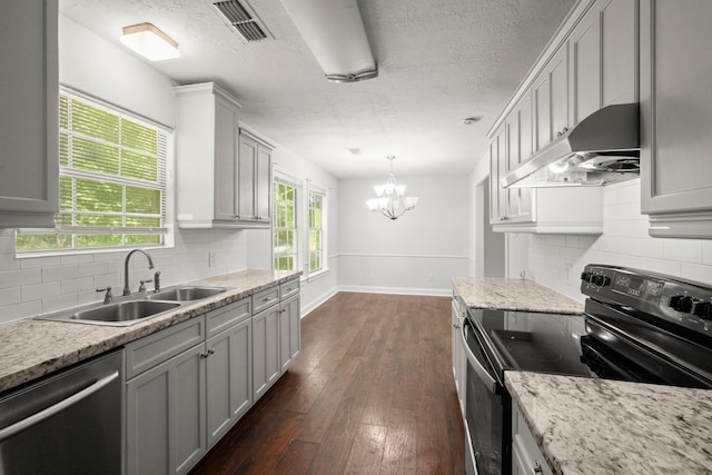 14790 N Tram Rd, Splendora, TX 77372 - kitchen with black electric range oven, stainless steel dishwasher, extractor fan, a sink, and a chandelier