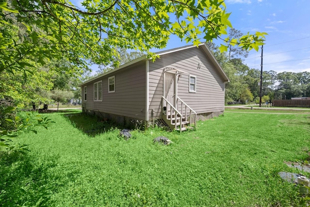 14790 N Tram Rd, Splendora, TX 77372 - view of property exterior featuring entry steps and a yard