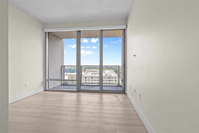 2047 Westcreek Ln Unit 1105, Houston, TX 77027 - unfurnished room featuring wood finished floors and baseboards