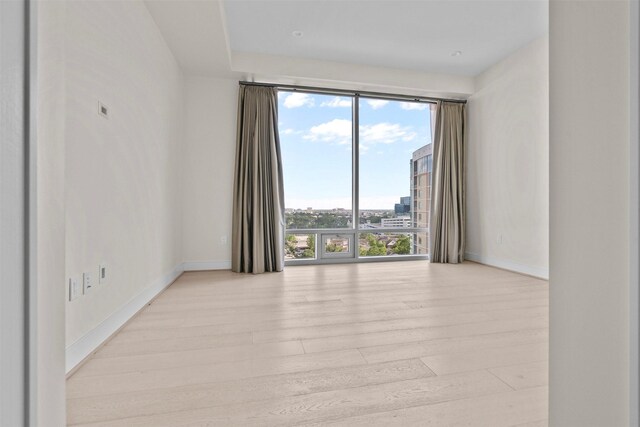 2047 Westcreek Ln Unit 1105, Houston, TX 77027 - spare room with light wood finished floors and baseboards